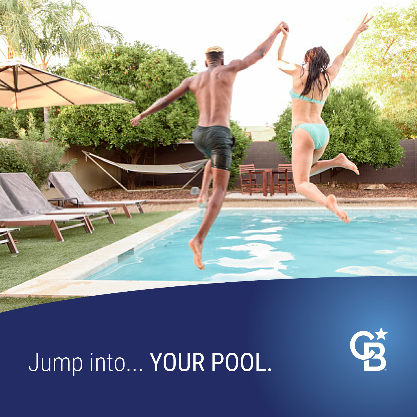 Man and woman jumping into swimming pool