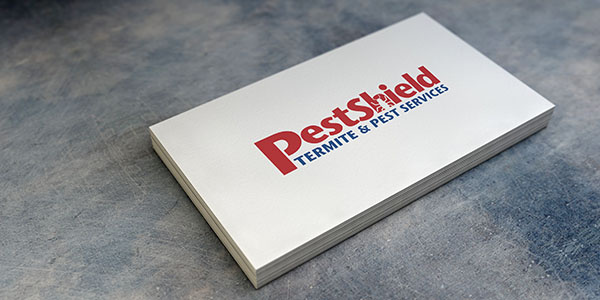 Pest Shield logo on business card